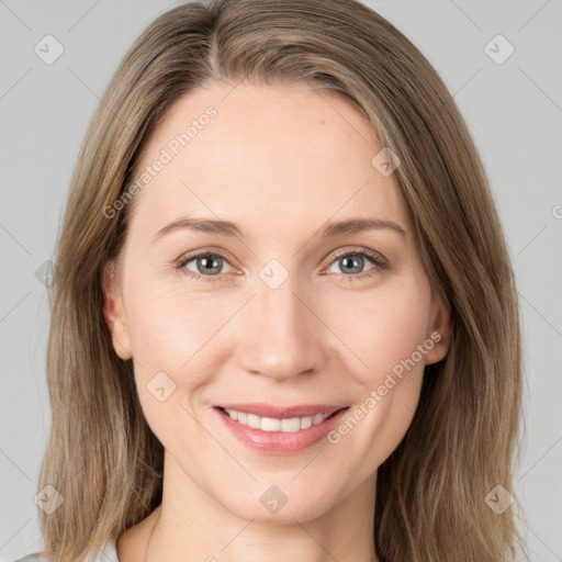 Joyful white young-adult female with medium  brown hair and green eyes