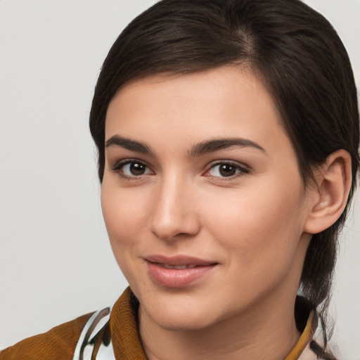 Joyful white young-adult female with medium  brown hair and brown eyes