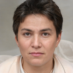 Joyful white adult female with short  brown hair and brown eyes