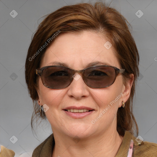 Joyful white young-adult female with medium  brown hair and blue eyes