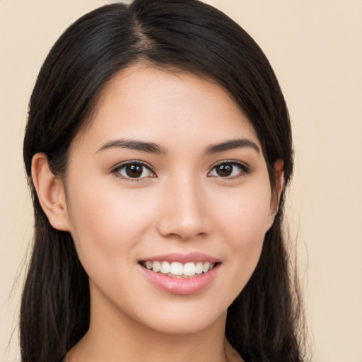 Joyful white young-adult female with long  brown hair and brown eyes