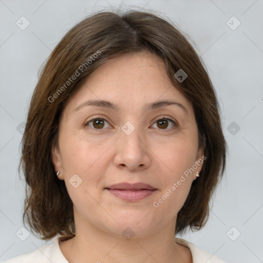 Joyful white adult female with medium  brown hair and brown eyes