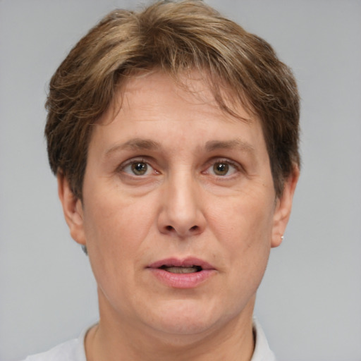 Joyful white adult female with short  brown hair and brown eyes