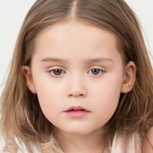 Neutral white child female with long  brown hair and brown eyes