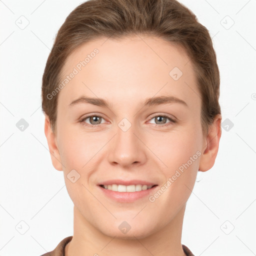 Joyful white young-adult female with short  brown hair and grey eyes