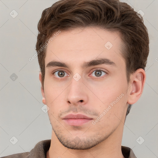 Neutral white young-adult male with short  brown hair and grey eyes