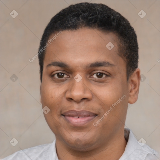 Joyful black young-adult male with short  black hair and brown eyes