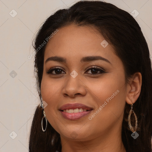 Joyful latino young-adult female with long  brown hair and brown eyes