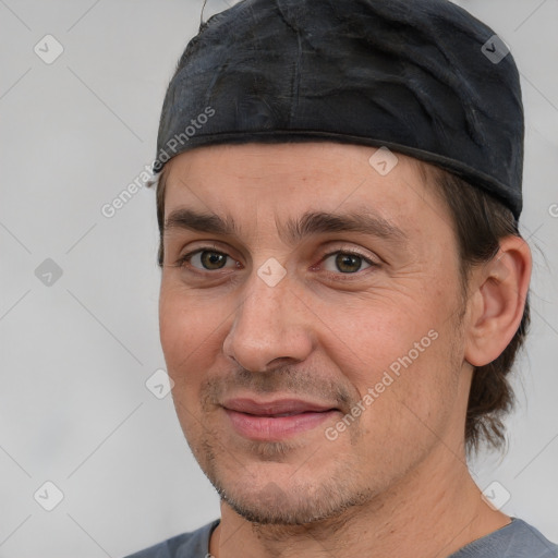 Joyful white adult male with short  brown hair and brown eyes