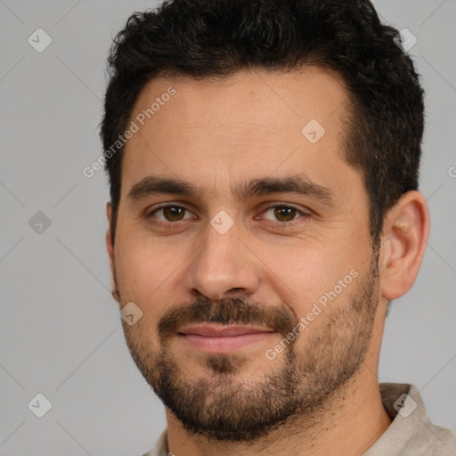 Joyful white adult male with short  brown hair and brown eyes