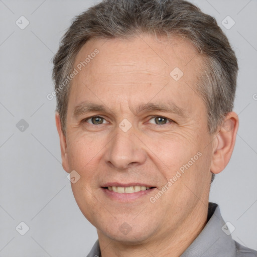 Joyful white adult male with short  brown hair and brown eyes