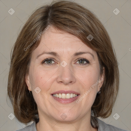 Joyful white adult female with medium  brown hair and grey eyes