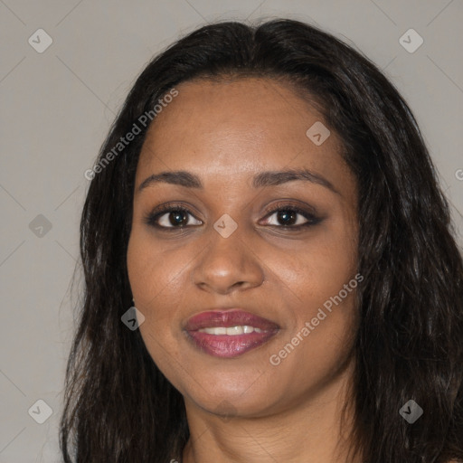 Joyful black young-adult female with long  black hair and brown eyes