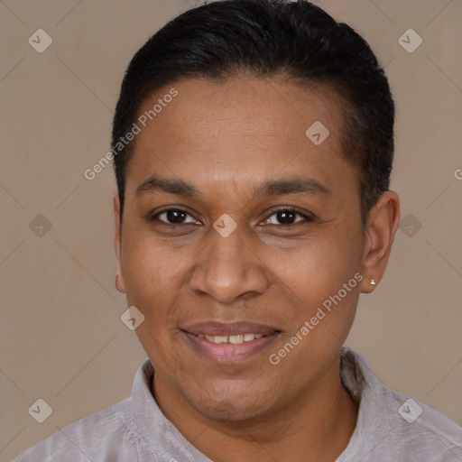 Joyful latino adult male with short  black hair and brown eyes