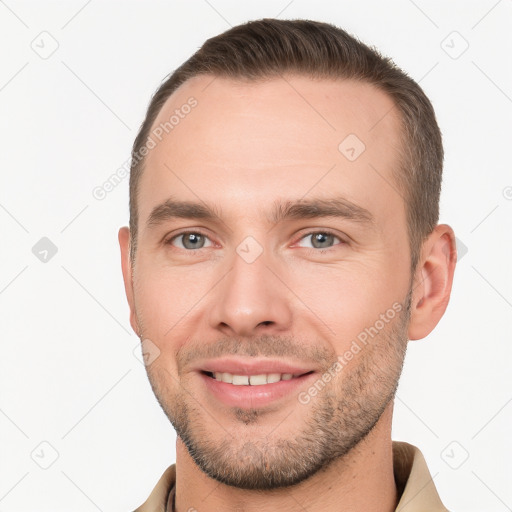 Joyful white young-adult male with short  brown hair and brown eyes