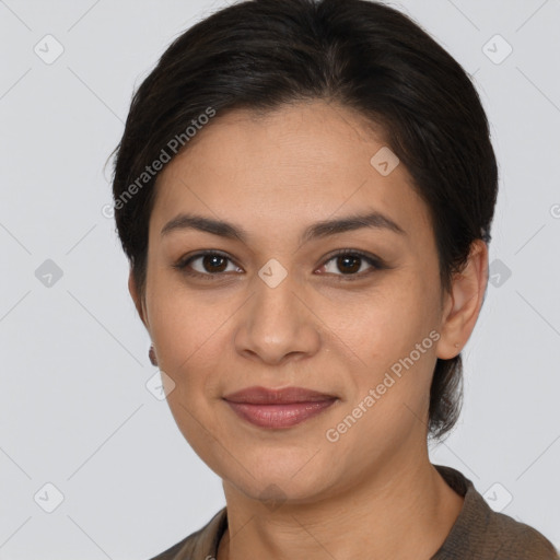 Joyful latino young-adult female with short  brown hair and brown eyes