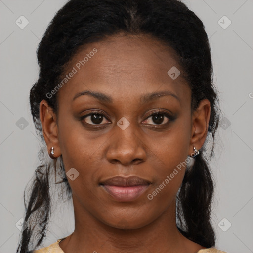 Joyful black young-adult female with medium  brown hair and brown eyes