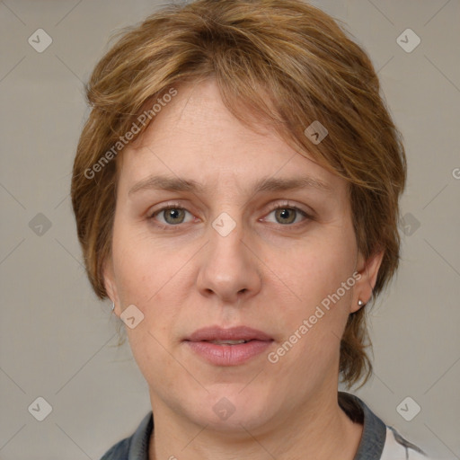 Joyful white adult female with medium  brown hair and grey eyes