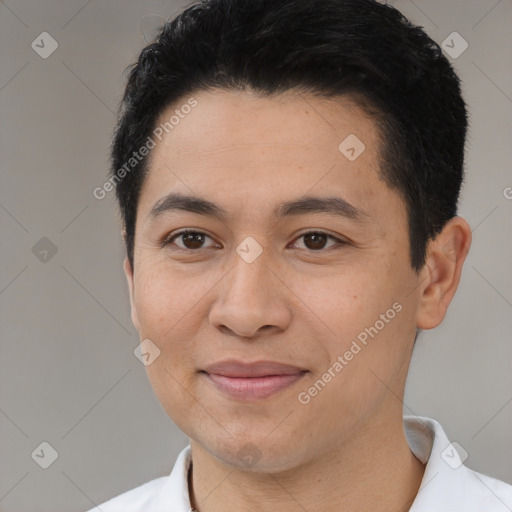 Joyful latino young-adult male with short  black hair and brown eyes