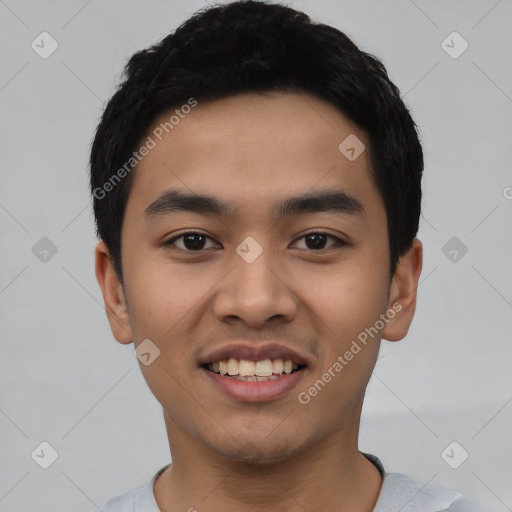 Joyful asian young-adult male with short  black hair and brown eyes