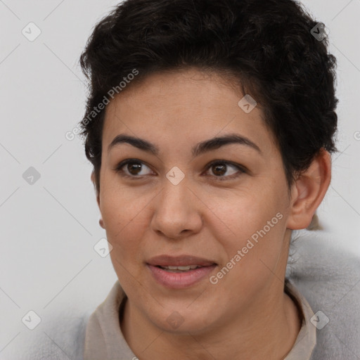 Joyful latino young-adult female with short  brown hair and brown eyes