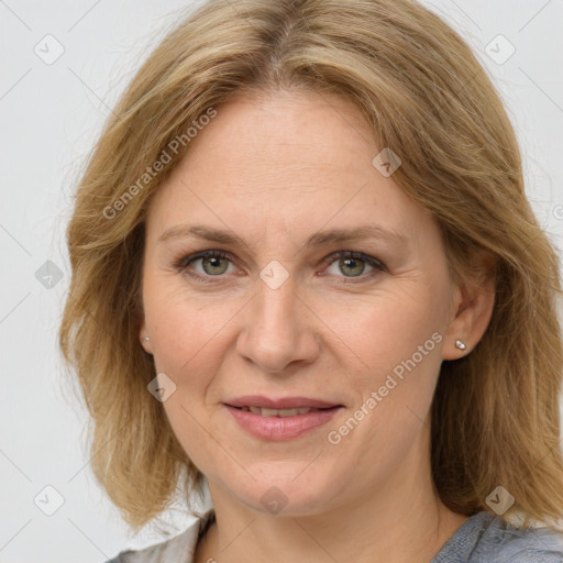 Joyful white adult female with medium  brown hair and grey eyes