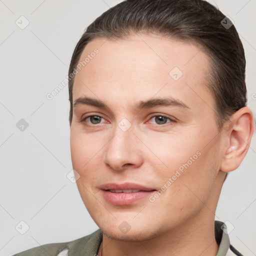 Joyful white young-adult female with short  brown hair and brown eyes