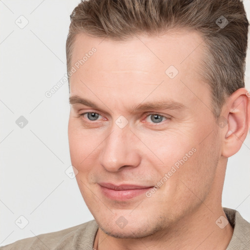 Joyful white adult male with short  brown hair and brown eyes