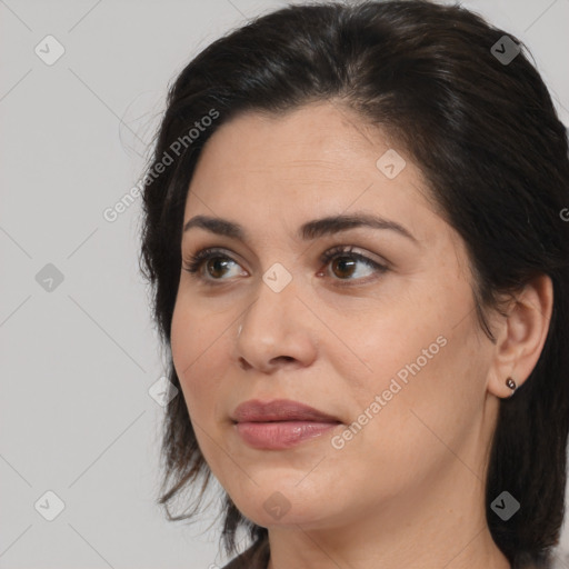 Joyful white adult female with medium  brown hair and brown eyes