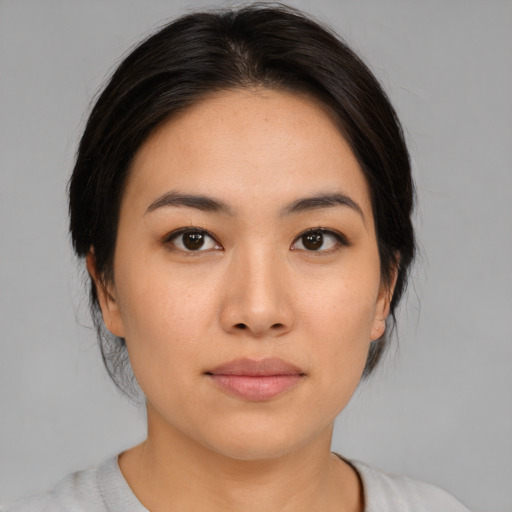 Neutral asian young-adult female with medium  brown hair and brown eyes