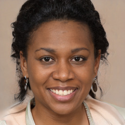 Joyful black young-adult female with medium  brown hair and brown eyes