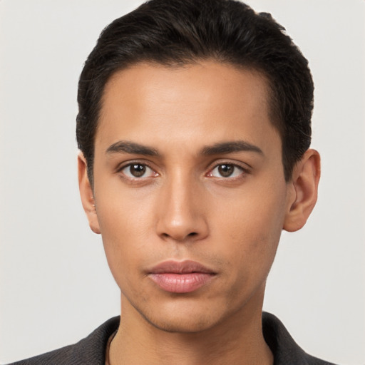 Neutral latino young-adult male with short  black hair and brown eyes