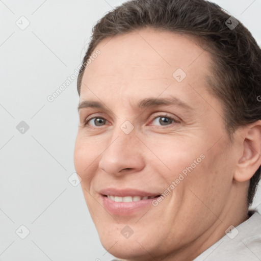 Joyful white adult female with short  brown hair and brown eyes