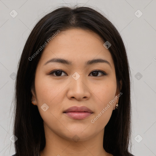 Joyful asian young-adult female with long  brown hair and brown eyes