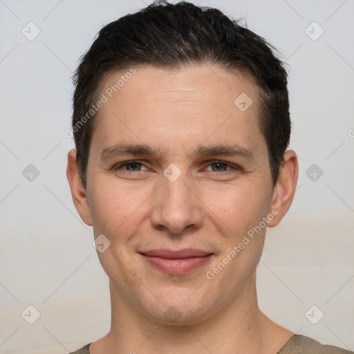 Joyful white young-adult male with short  brown hair and brown eyes