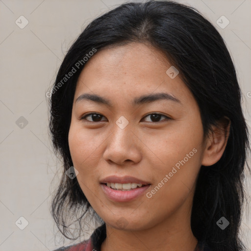 Joyful asian young-adult female with long  brown hair and brown eyes