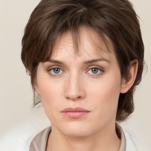 Neutral white young-adult female with medium  brown hair and grey eyes