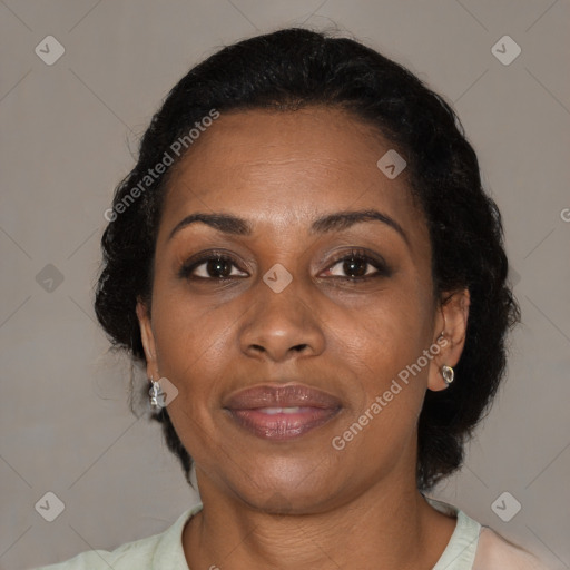 Joyful black adult female with medium  brown hair and brown eyes