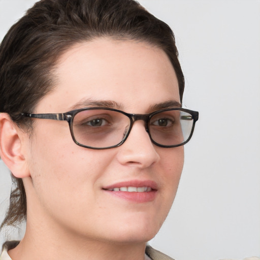 Joyful white young-adult female with short  brown hair and blue eyes