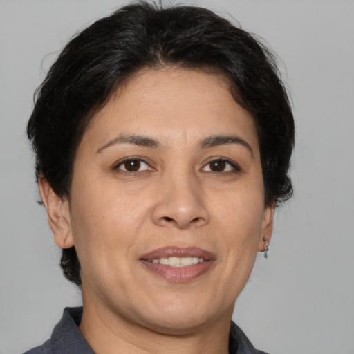 Joyful white adult female with short  brown hair and brown eyes