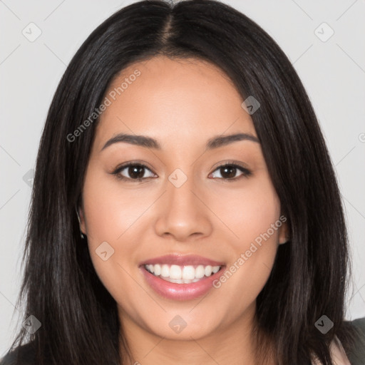 Joyful latino young-adult female with long  black hair and brown eyes