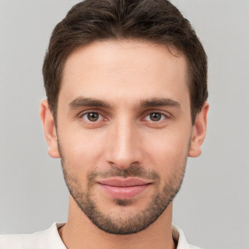 Joyful white young-adult male with short  brown hair and brown eyes