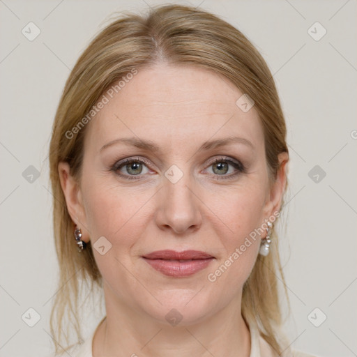 Joyful white adult female with medium  brown hair and blue eyes