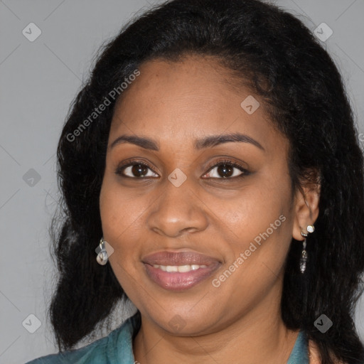 Joyful black young-adult female with long  black hair and brown eyes