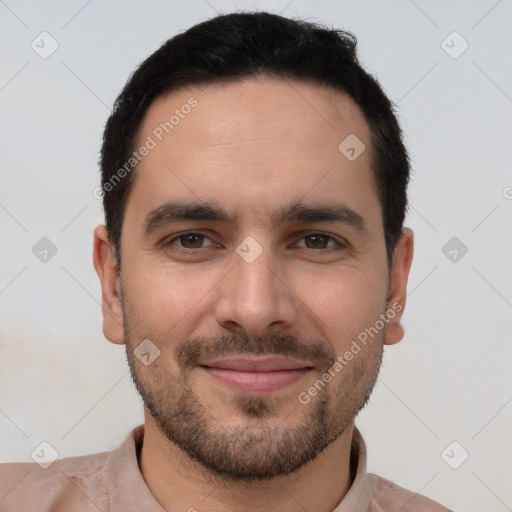 Joyful white young-adult male with short  black hair and brown eyes