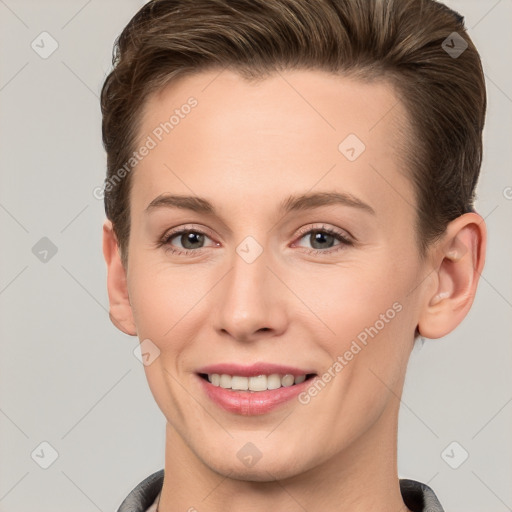 Joyful white young-adult female with short  brown hair and grey eyes