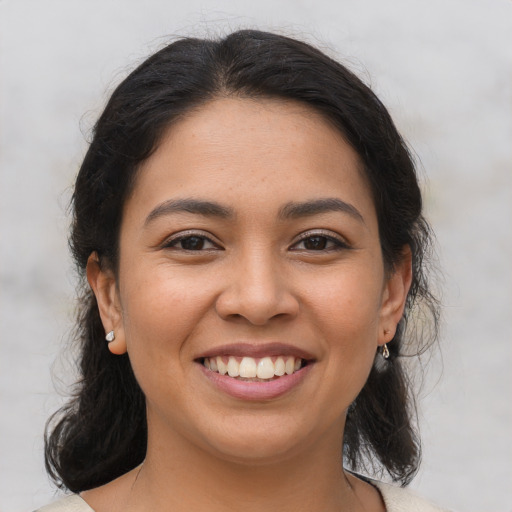 Joyful asian young-adult female with medium  brown hair and brown eyes