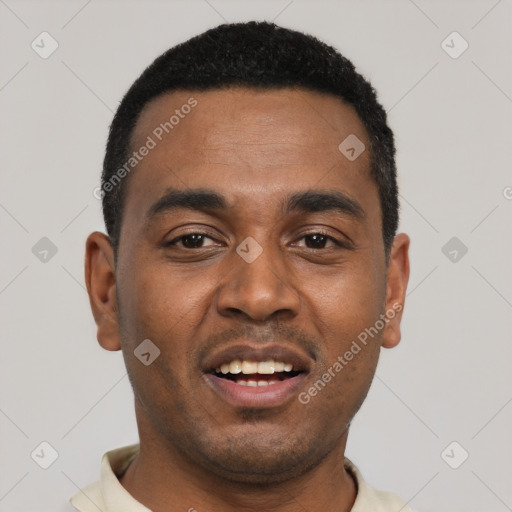Joyful black young-adult male with short  black hair and brown eyes