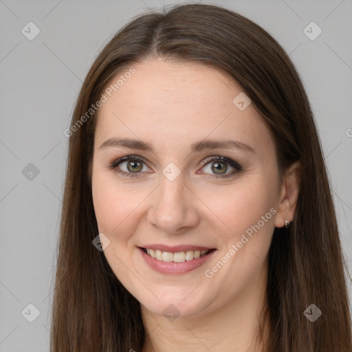 Joyful white young-adult female with long  brown hair and brown eyes