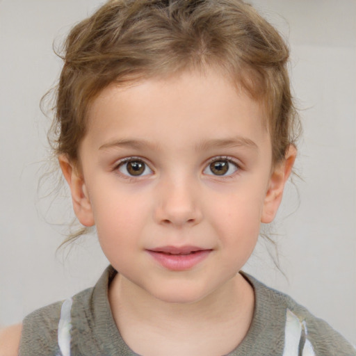 Joyful white child male with short  brown hair and brown eyes